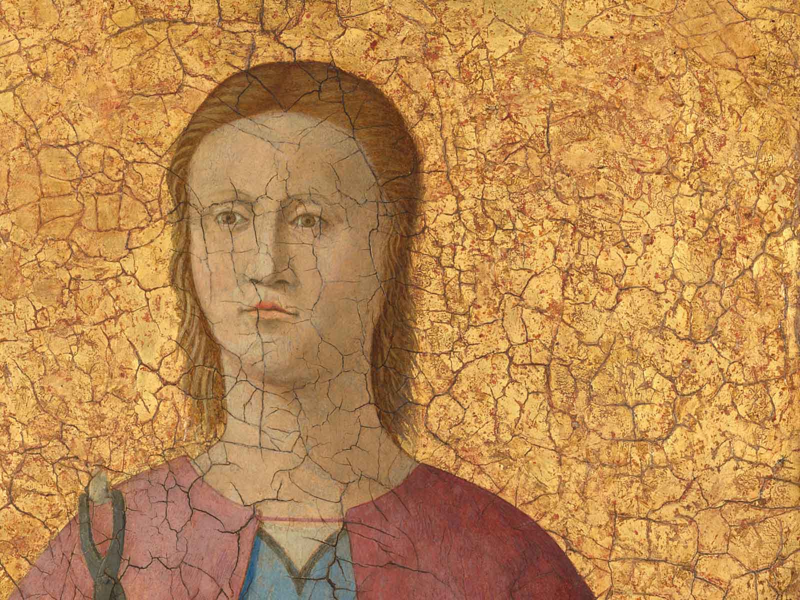Dettaglio del dipinto Sant'Apollonia di Piero della Francesca mostra il ritratto della santa su sfondo oro.